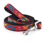 Colorful comic-book lettering and burst shapes on red nylon dog leash, coiled