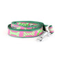 Repeating bone shapes on patterned ribbon nylon dog leash, Pink colorway coiled