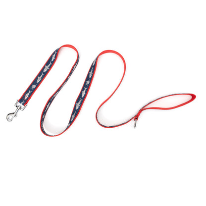 Light-colored shark silhouettes on navy ribbon nylon dog leash, extended