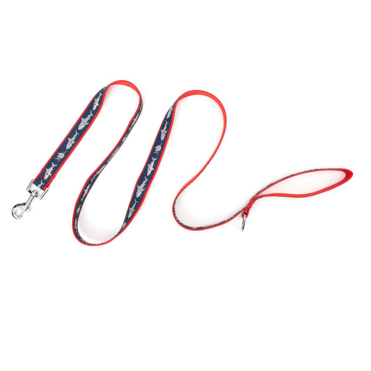 Light-colored shark silhouettes on navy ribbon nylon dog leash, extended