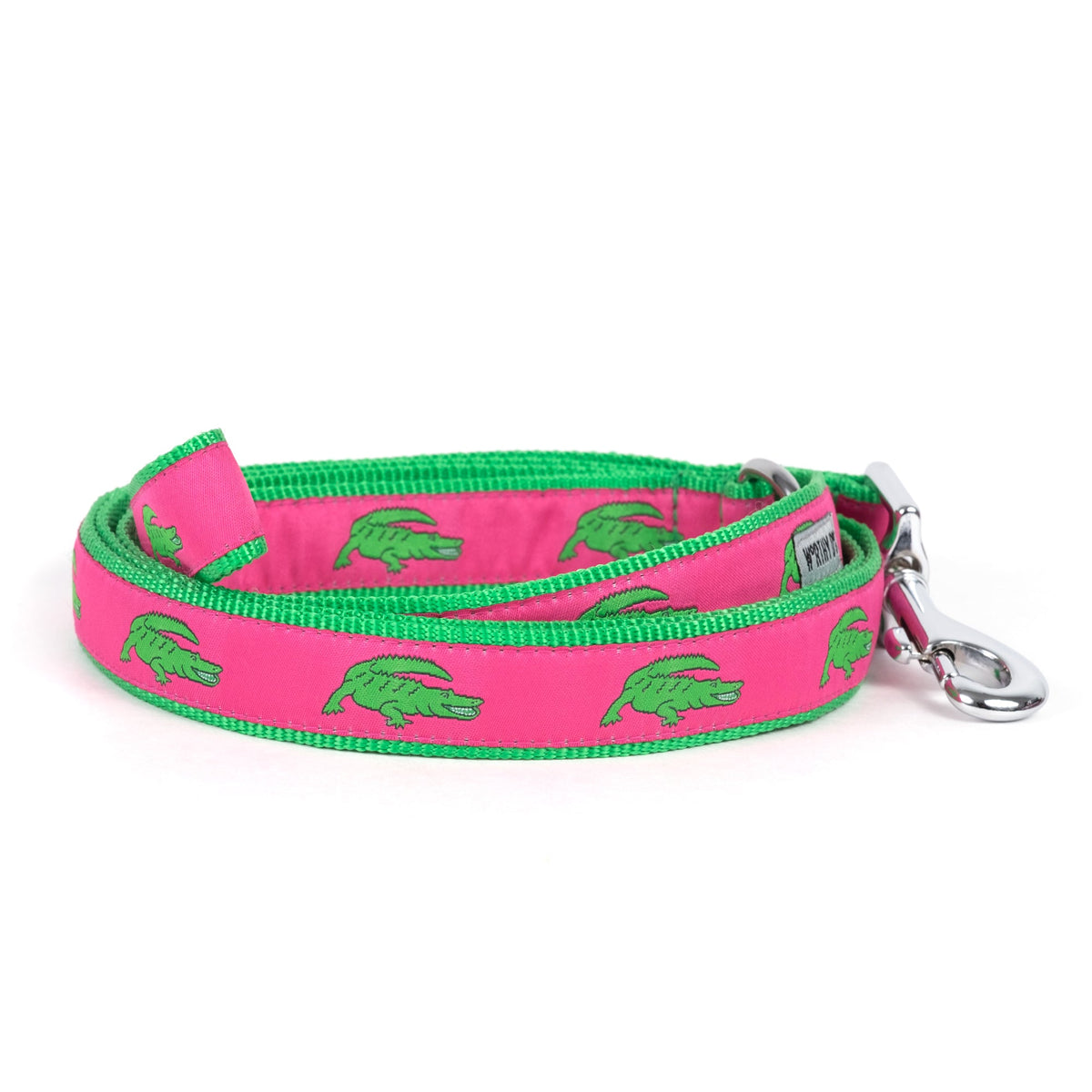 Alligator dog leash with green alligators on pink ribbon, green nylon backing and metal snap hook