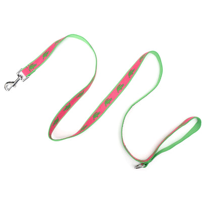 Pink alligator dog leash extended to show ribbon pattern, loop handle and snap hook