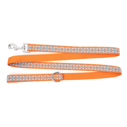 Repeating decorative stamp-style motifs nylon dog leash, patterned ribbon and orange backing detail