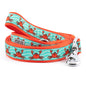 Red crabs on a teal patterned background nylon dog leash, coiled