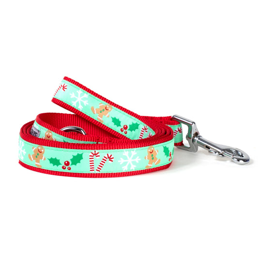 Gingerbread figures on green ribbon nylon dog leash, coiled
