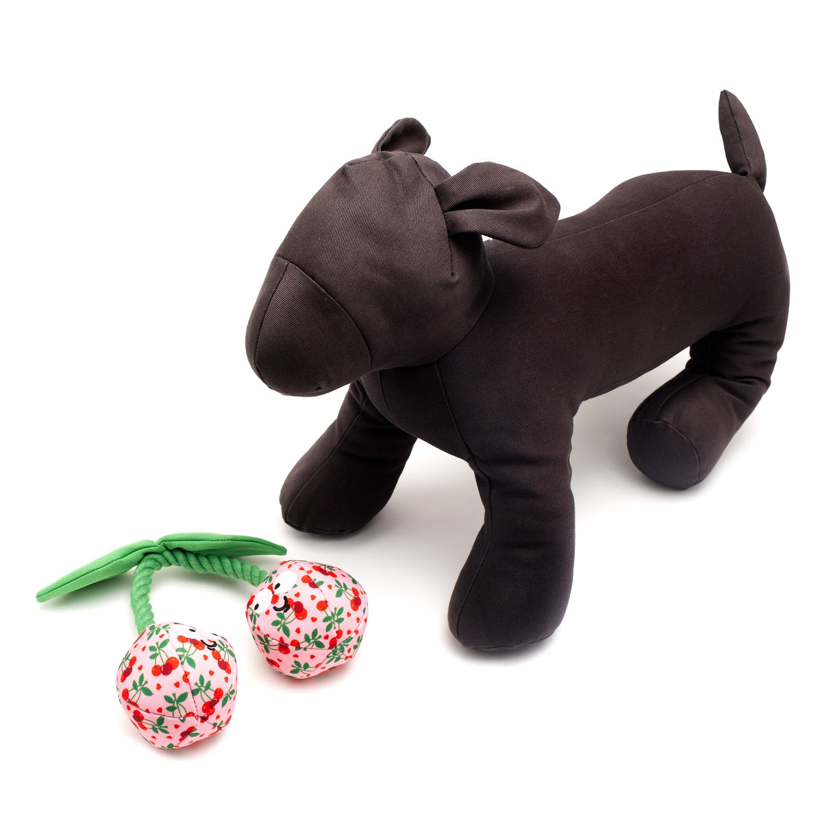 Pink Cherries Squeaky Dog Toy, scale beside a display dog