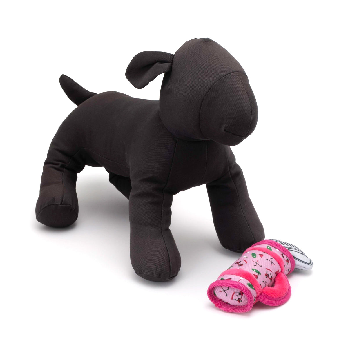 Golf Bag Squeaky Dog Toy, Pink golf bag beside a display dog