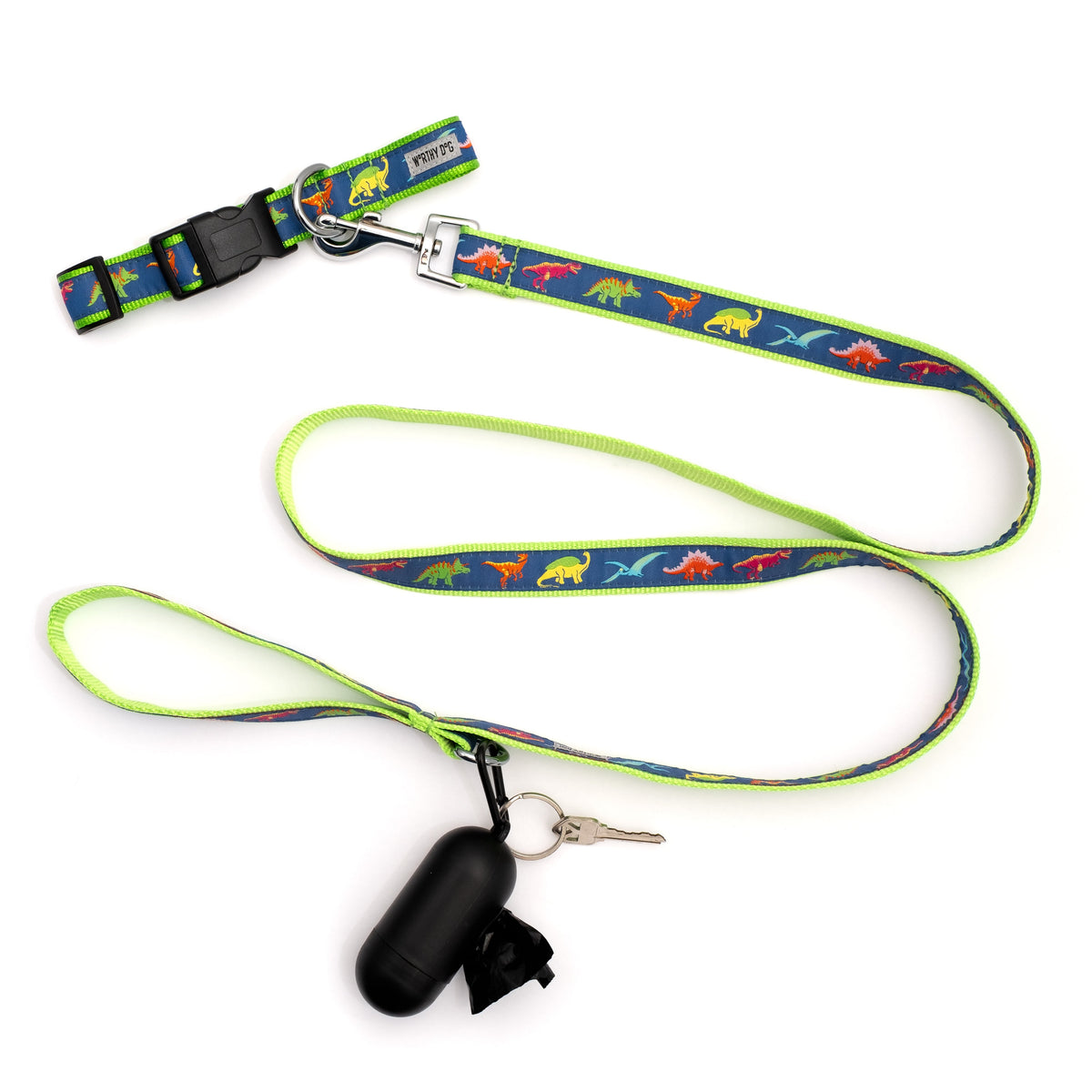 Colorful dinosaur illustrations on navy ribbon nylon dog leash, shown with matching accessories; accessories not included
