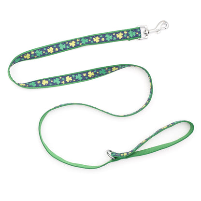 Green clover shapes on navy ribbon nylon dog leash, extended