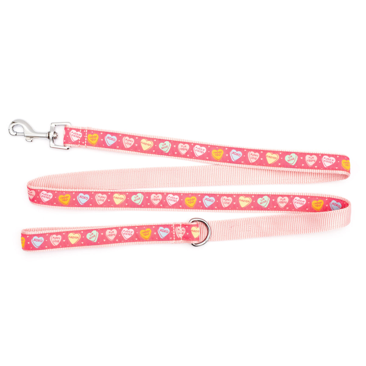 Colorful conversation-heart shapes on pink ribbon nylon dog leash, ribbon and pale pink backing detail