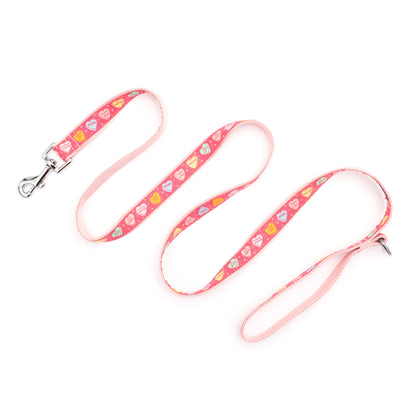 Colorful conversation-heart shapes on pink ribbon nylon dog leash, extended