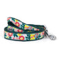 Colorful flowers and green foliage on pale ribbon nylon dog leash, coiled