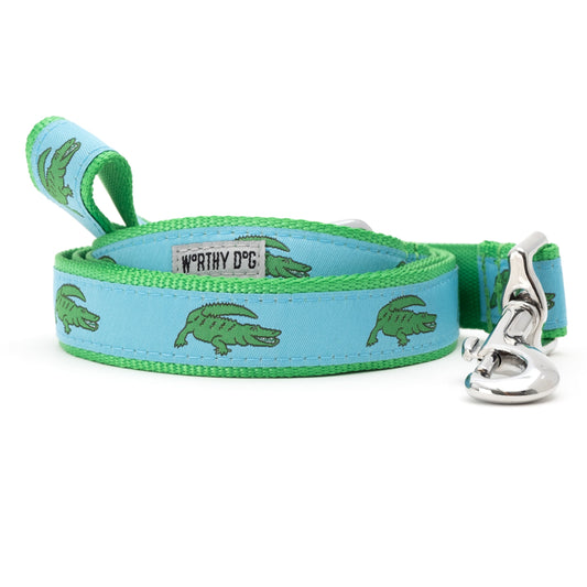 Alligator dog leash with green alligators on blue ribbon, green nylon backing and metal snap hook