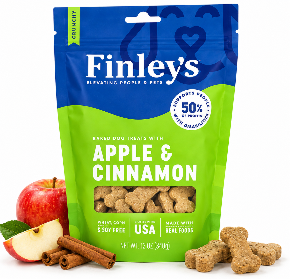 Finley's Apple & Cinnamon baked dog treats in a blue and green stand-up pouch, shown with whole and sliced red apples and cinnamon sticks on a white background.
