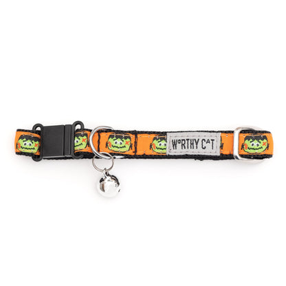 Frankenstein faces on orange ribbon Halloween cat collar, buckle and bell detail