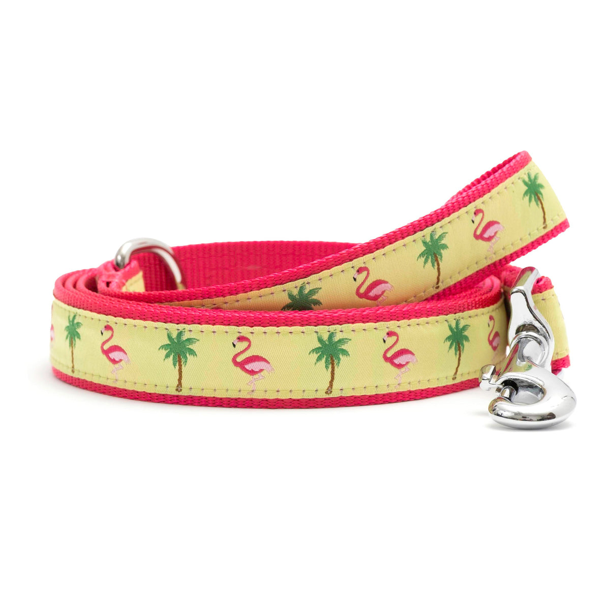 Pink flamingos and green palm trees on yellow ribbon nylon dog leash, coiled