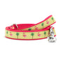Pink flamingos and green palm trees on yellow ribbon nylon dog leash, coiled