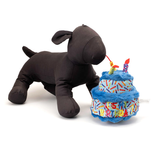Birthday Cake Squeaky Dog Toy, Blue cake beside a display dog
