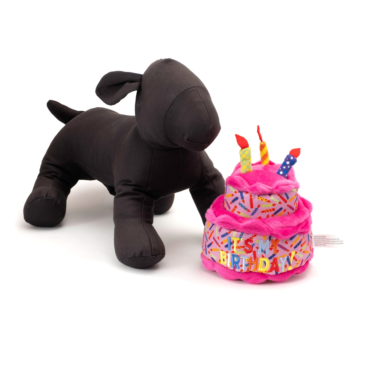 Birthday Cake Squeaky Dog Toy, Pink cake beside a display dog