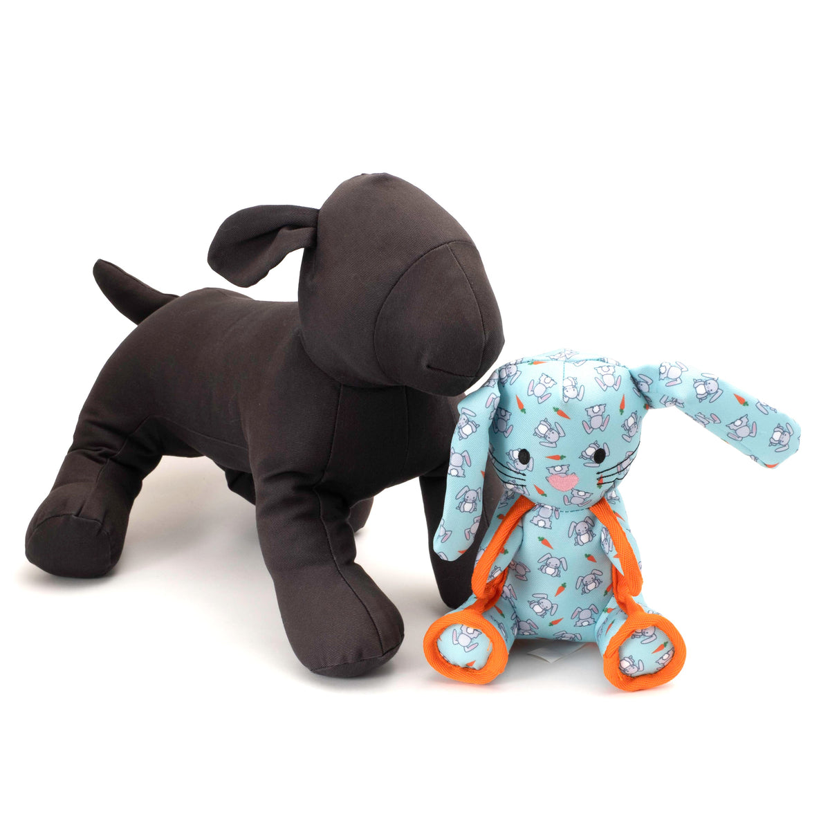 Mint Bunny Squeaky Dog Toy with Orange Rope Details, scale beside a display dog