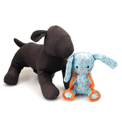 Mint Bunny Squeaky Dog Toy with Orange Rope Details, scale beside a display dog
